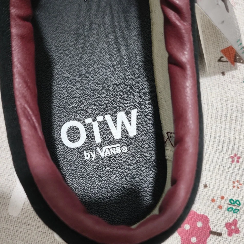 Vans Black Canvas Slip-On Sneakers with Maroon Lining and White Stud Detail